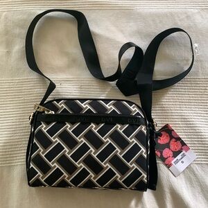 Diane von Furstenberg purse with adjustable strap.